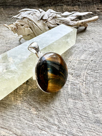 925 Silver Circle Tiger's Eye Pendant: Timeless Charm with Earthy Energies